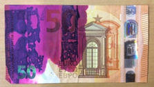 stained 5 euro banknote